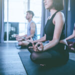 Yoga group concept; young people practicing yoga in class; feeling Calmness and relax in yoga class