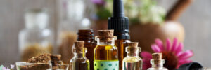 Selection of aromatherapy essential oil with myrrh, frankincense, echinacea and other herbs and flowers