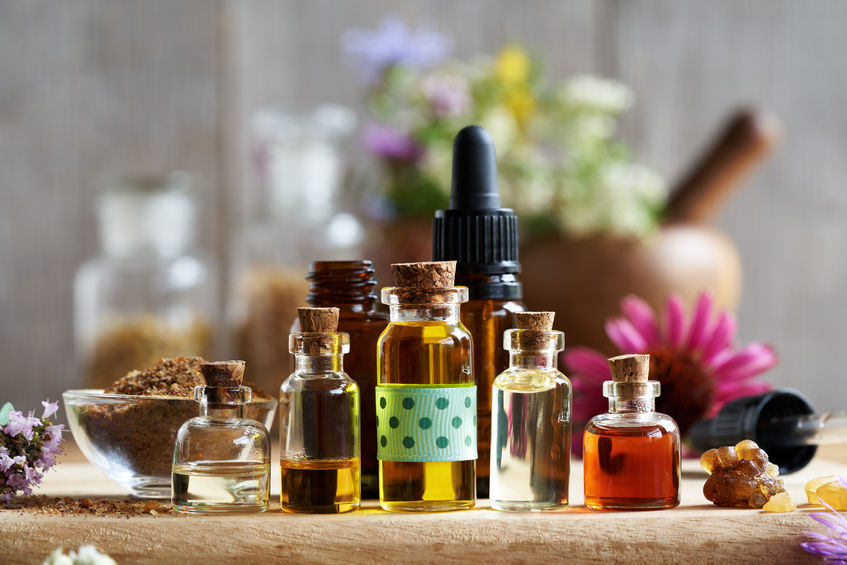 Selection of aromatherapy essential oil with myrrh, frankincense, echinacea and other herbs and flowers
