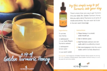 A glass mug of yellow turmeric honey drink sits on a saucer, with a turmeric honey bottle and recipe instructions beside it.